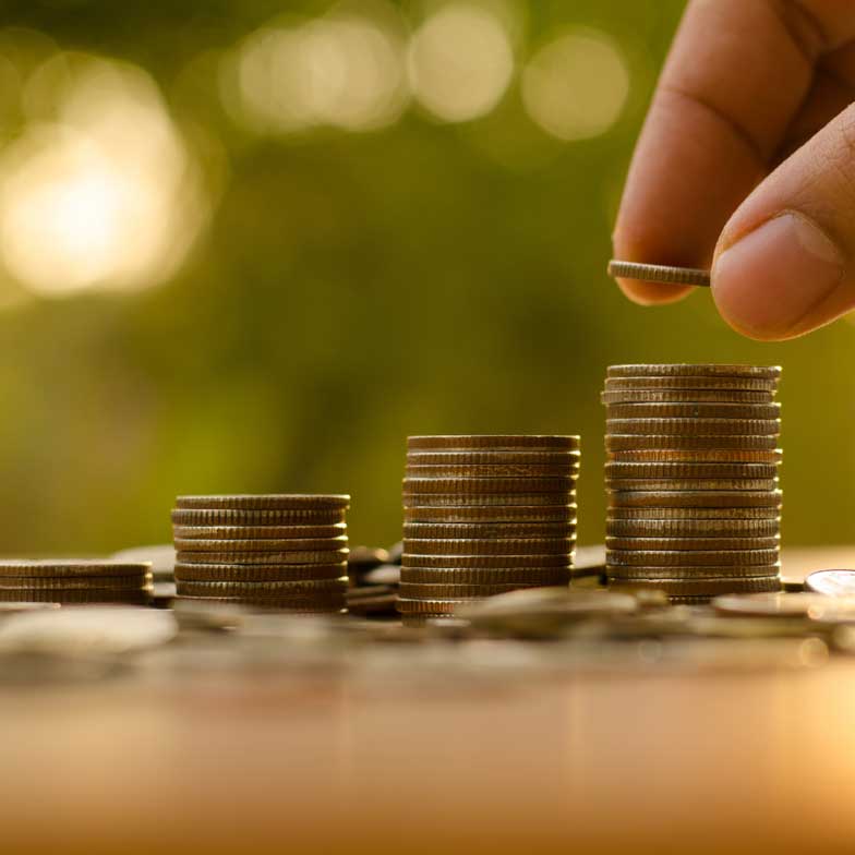 Coins stacked in a graph showing growth