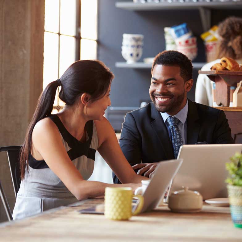 Two business people meeting at a cafe